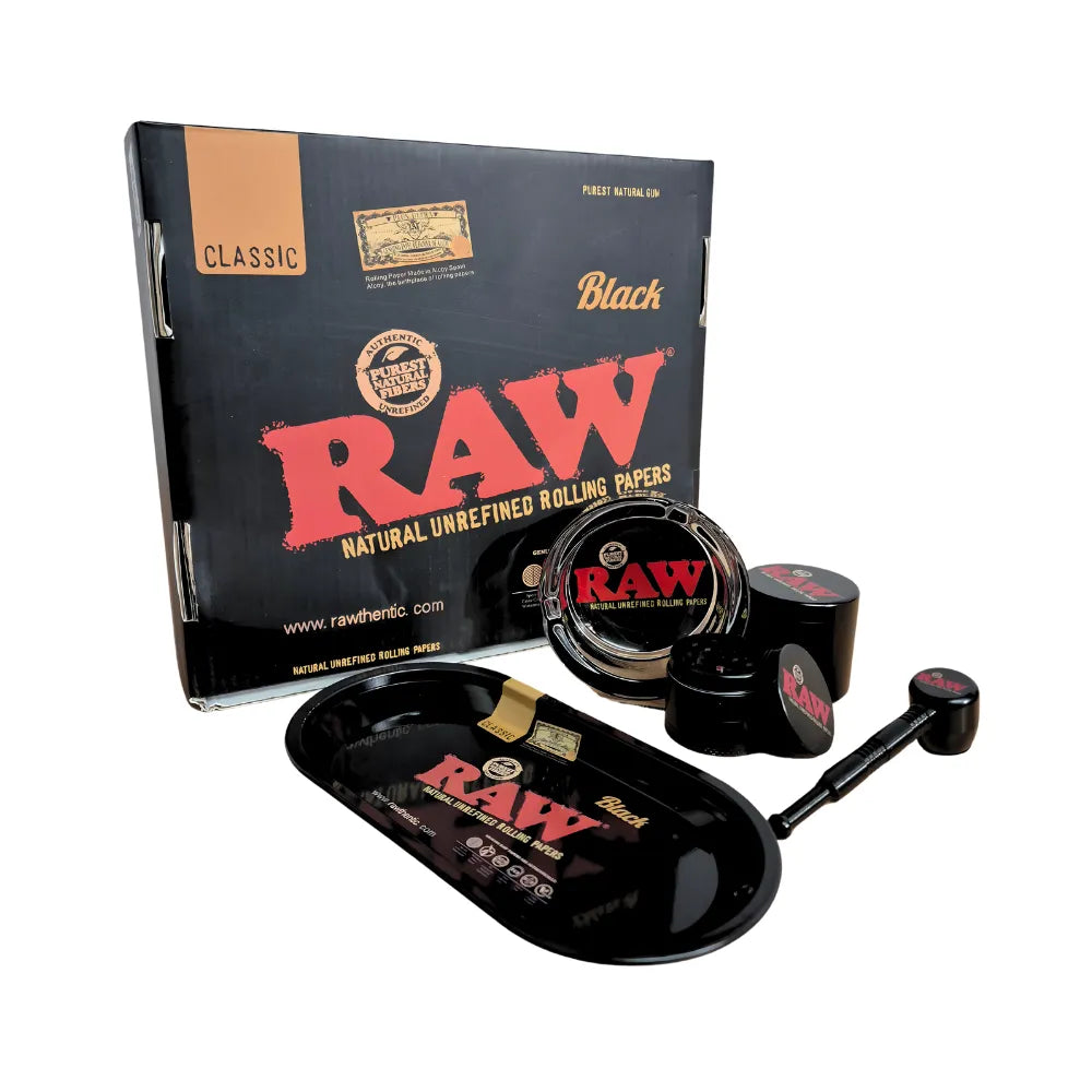 RAW black smoking gift set with packaging, ashtray, roll tray, grinder, pot and pipe on a white background