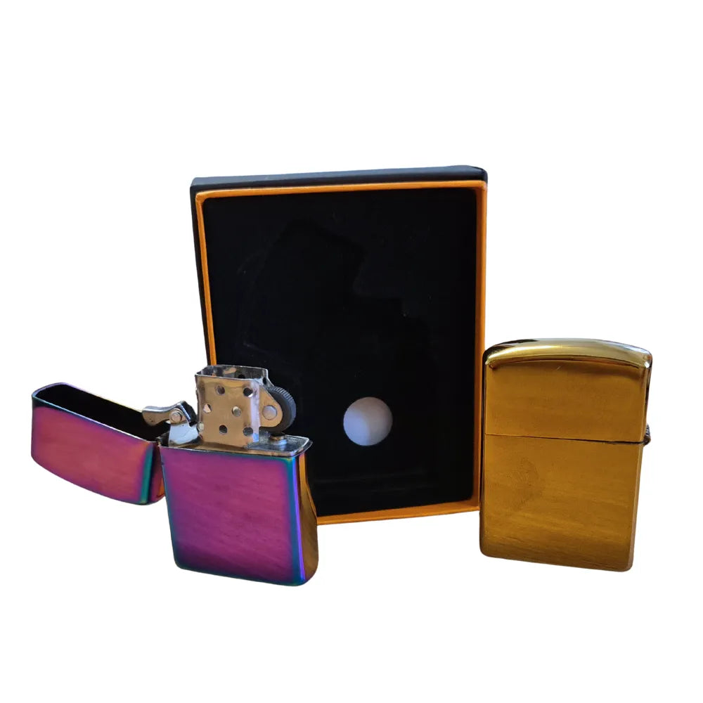Two flip-top metal lighters, one chrome and one gold, with a black box on a white background.