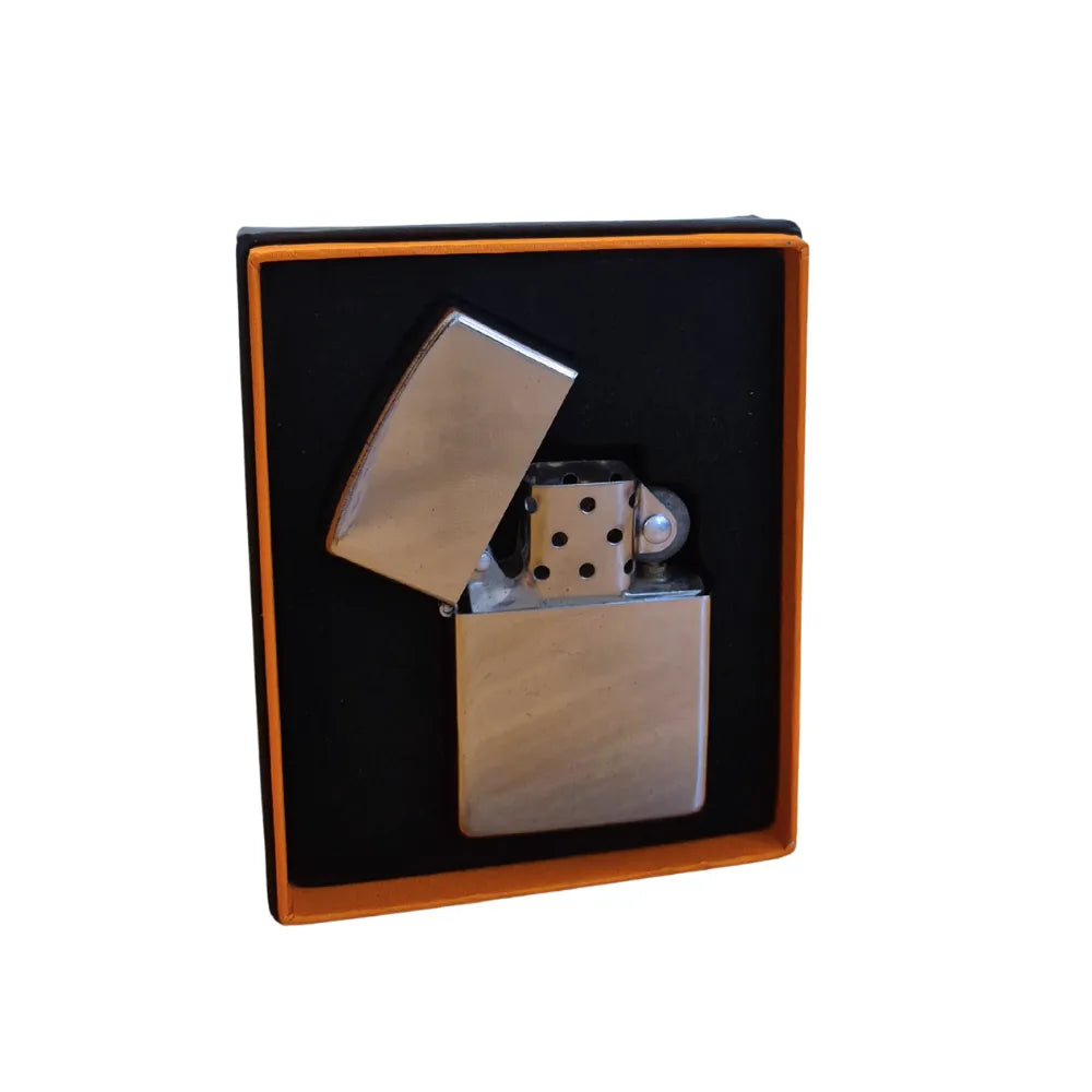 Silver flip-top lighter with metallic accents in a black box on a white background