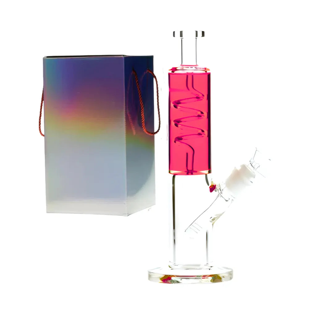 Glass smoking device with pink top and clear base next to a colourful box on a white background