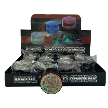 Metal tobacco grinders with colourful holographic design on a display box