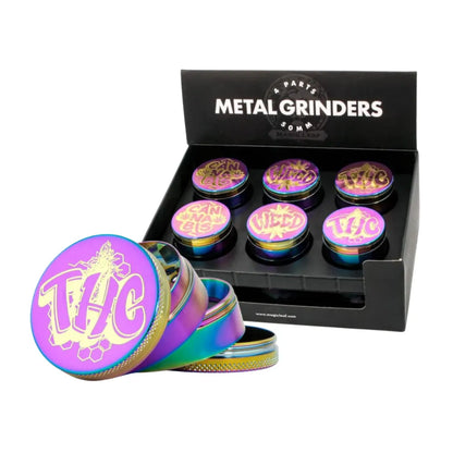 Magic Leaf metal grinders with 'THC' and colourful design in a black display box.