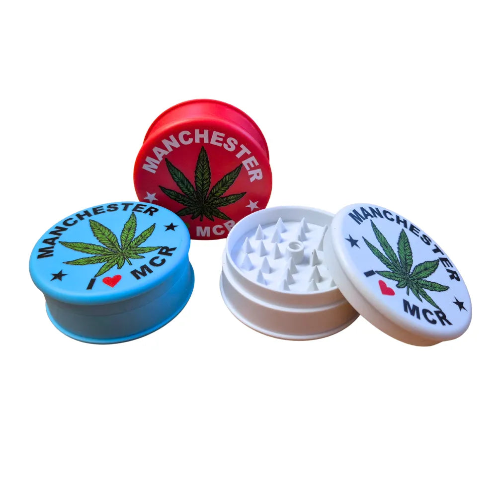 Three colourful Magic Leaf "Print-Collection" plastic grinders with "I Heart Manchester" inspired designs.