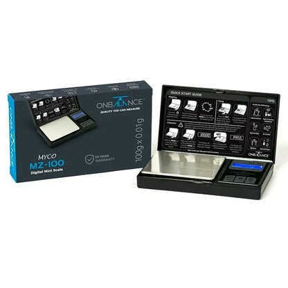 ONB MZ100 Digital mini scale with open packaging showing scale and user guide on a white background