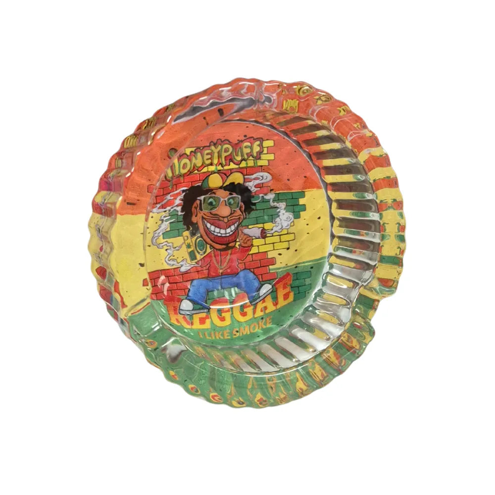Transparent colourful glass ashtray with a printed reggae design and 'Honey Puff' branding on a white background