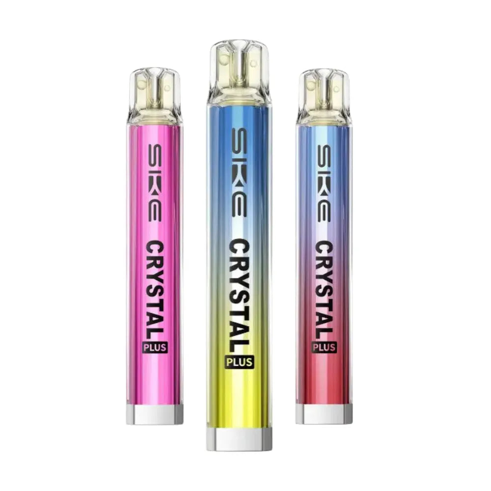 Three SKE Crystal Plus vape devices in pink, blue, and red on a white background