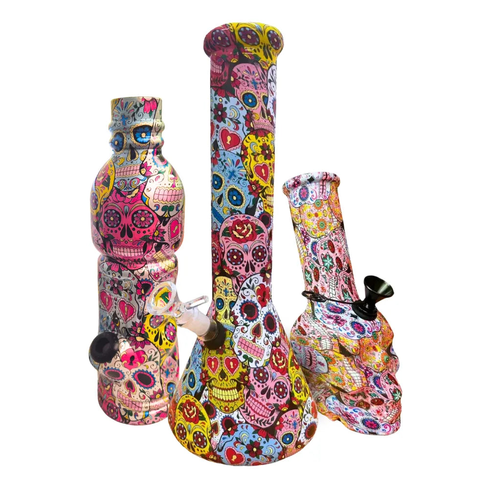 Three different sized colourful skull-patterned bongs on a white background