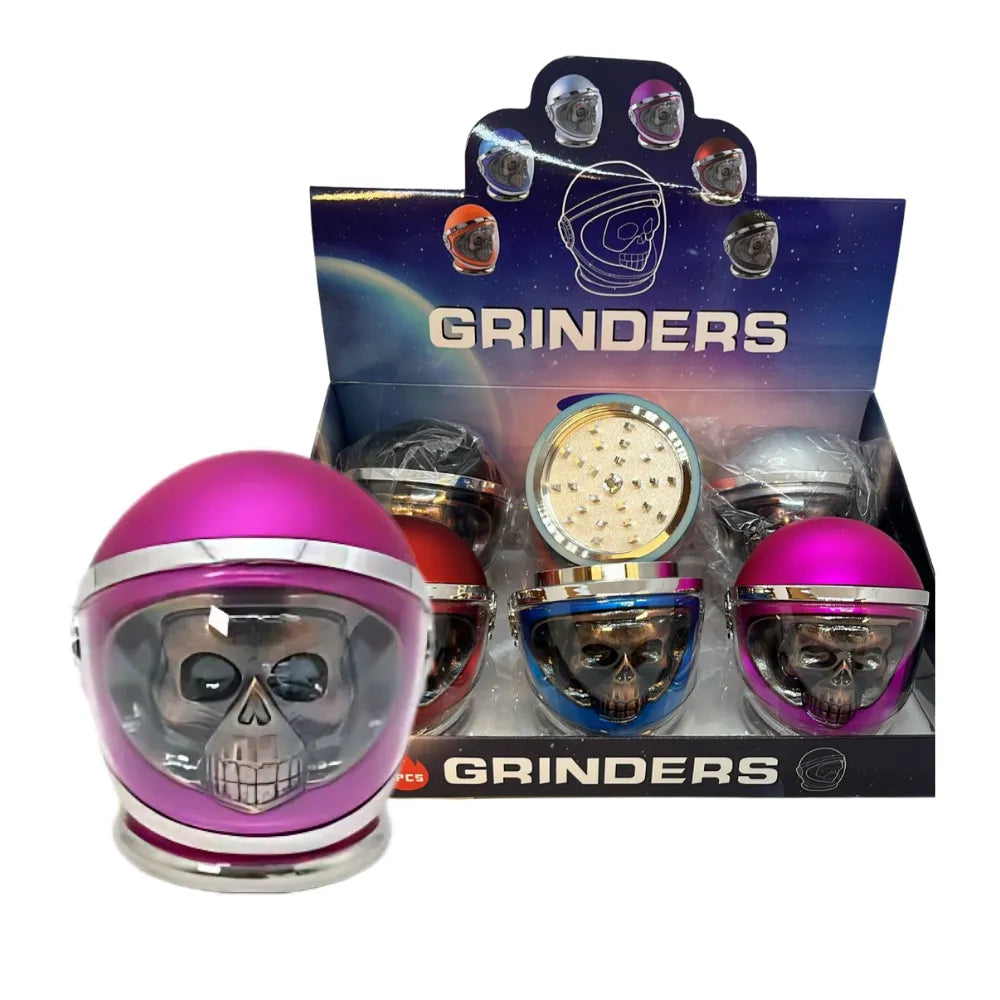 Display box of 'Grinders' with skull-shaped objects in colourful helmets.
