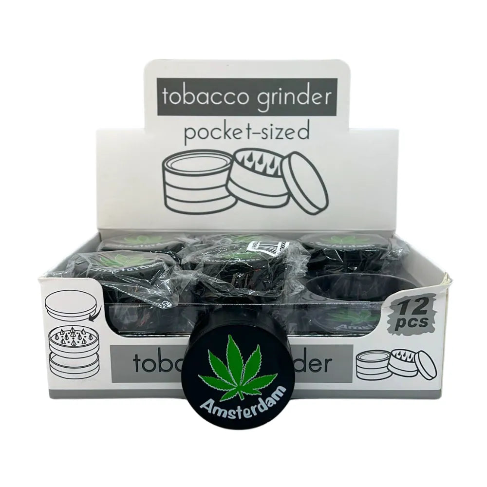 Box of pocket-sized tobacco grinders with a visible brand logo on a white background